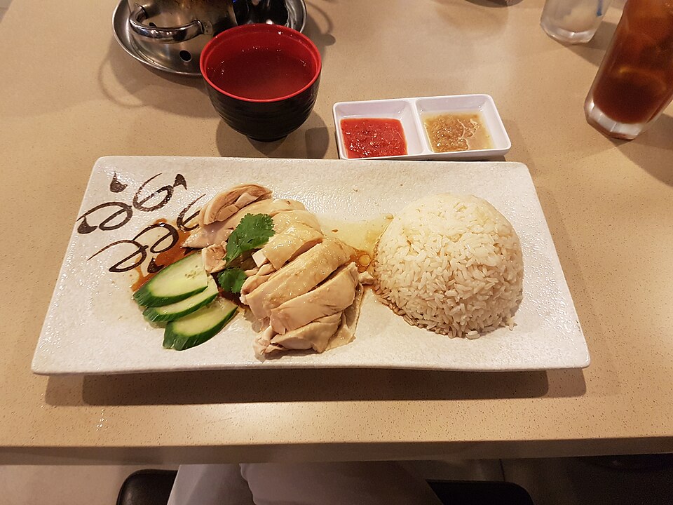 Illustrative Hainanese chicken rice, not a photo of a listed restaurant